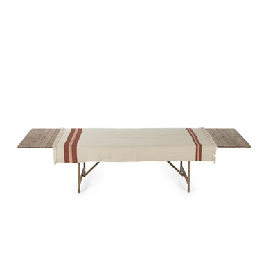 Folding table with a striped cloth on a white background