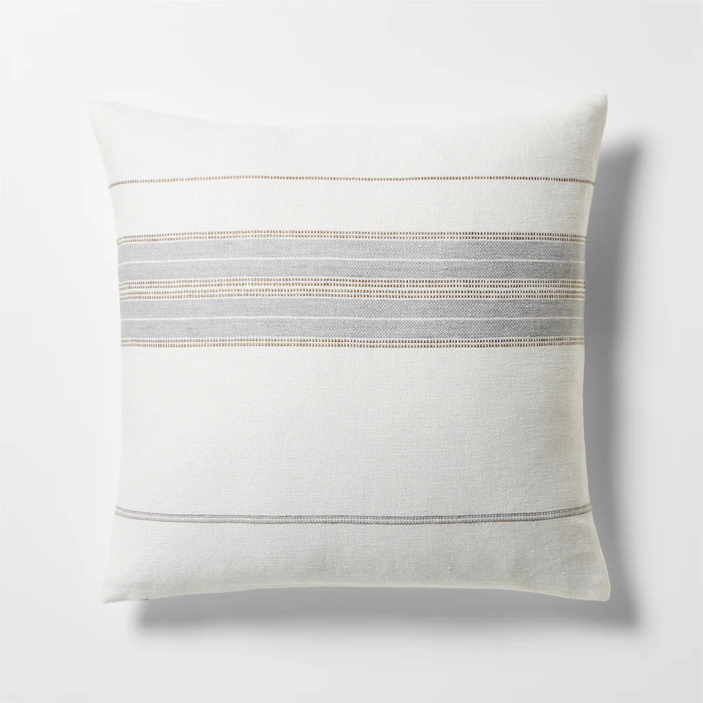 Decorative pillow with horizontal stripes on a light gray background