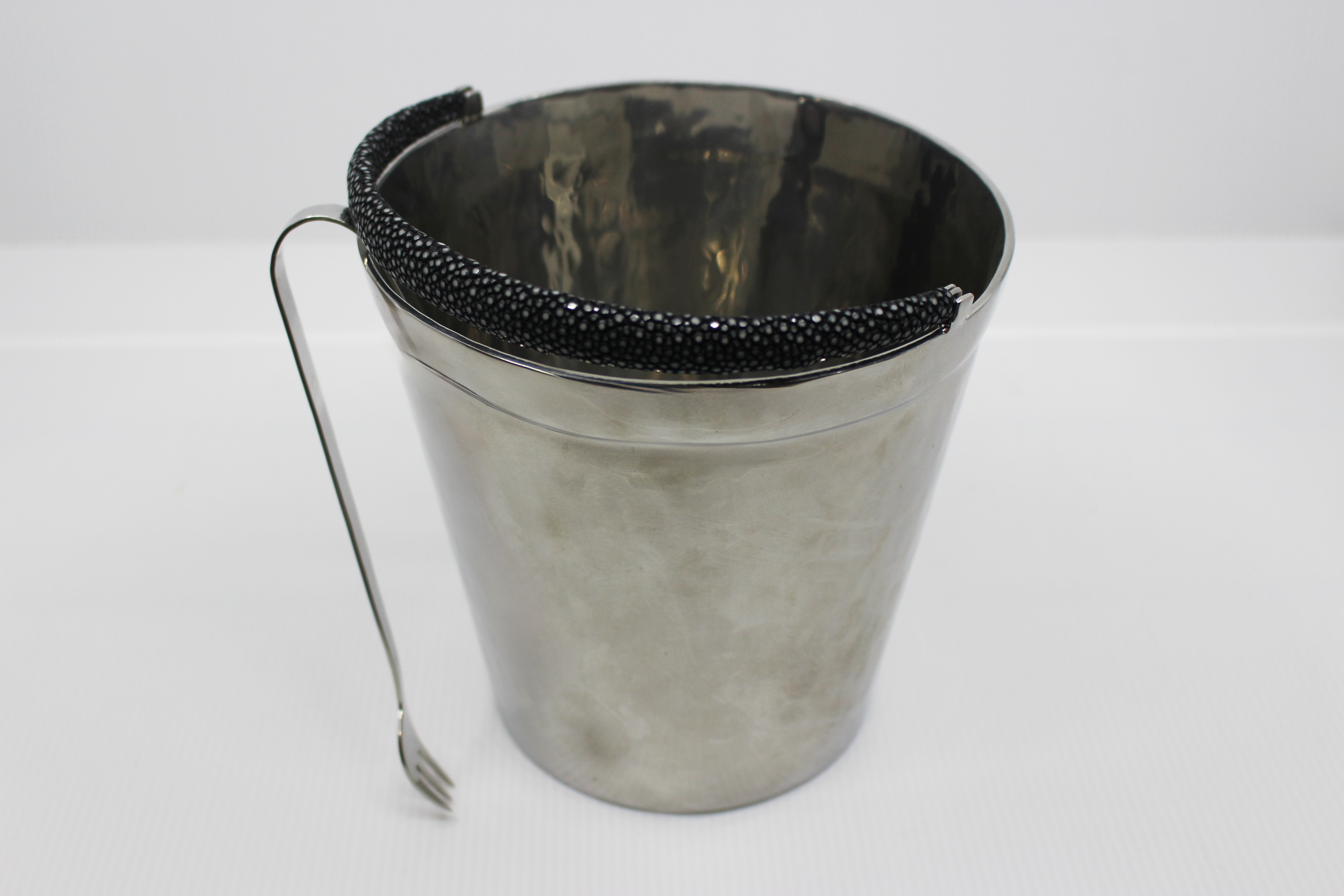 Metal bucket with black rim on a white background
