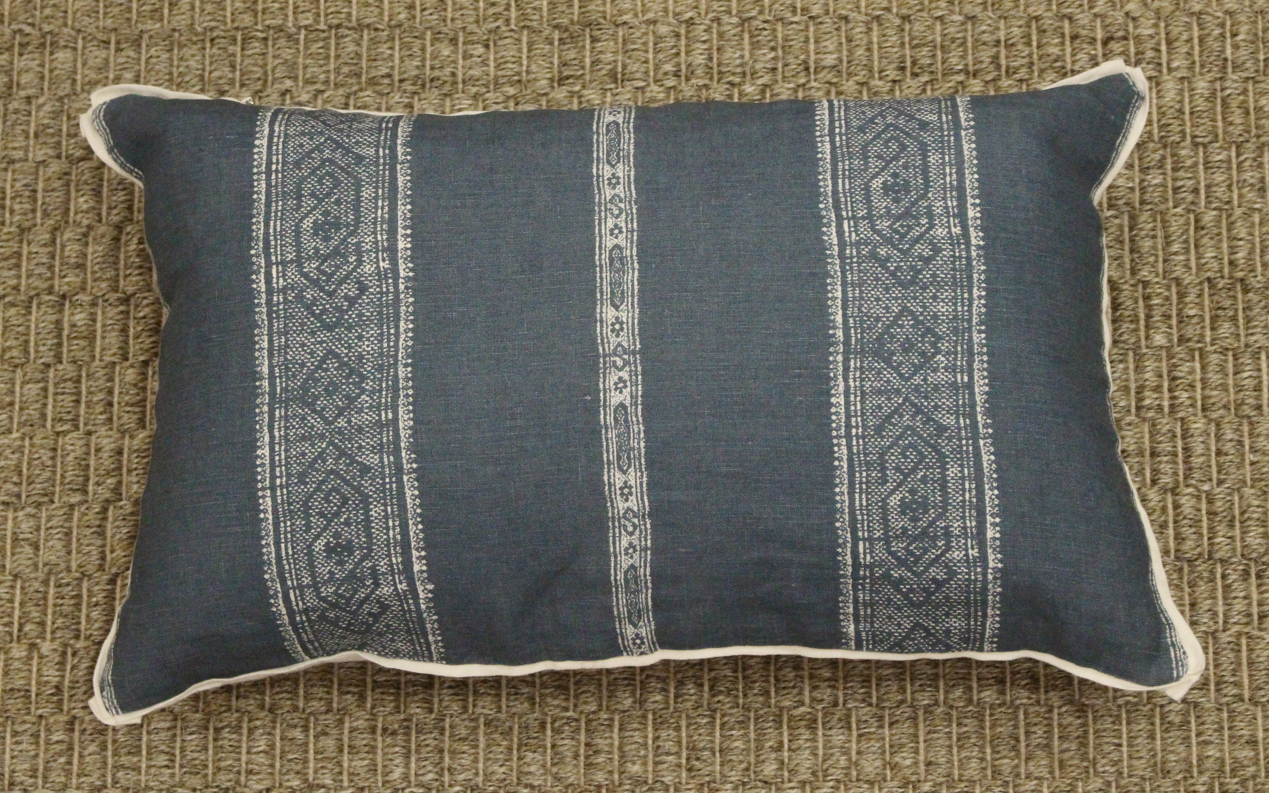 slate blue textile pillow with stripe design