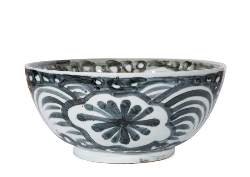 side view of ceramic bowl with indigo handpainting inside and out
