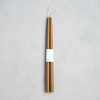 caramel colored pair of candles