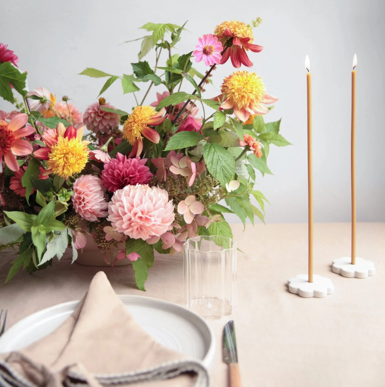 table setting with flowers and candles
