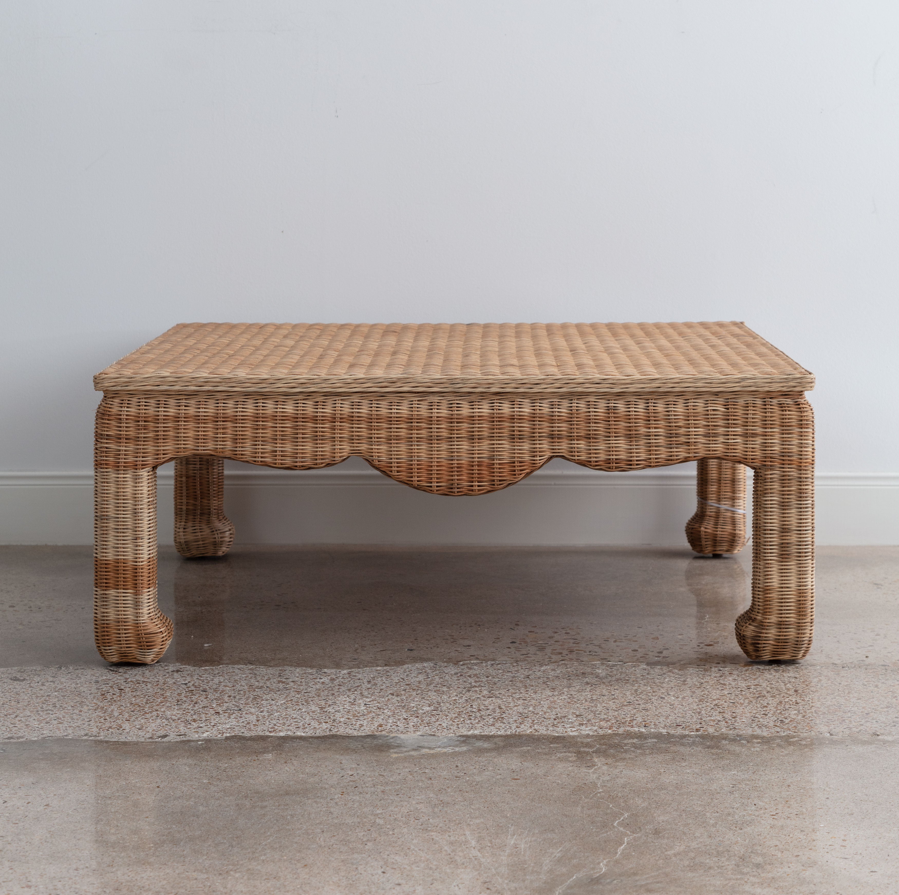 wicker coffee table with curved apron and Asian-influenced style legs