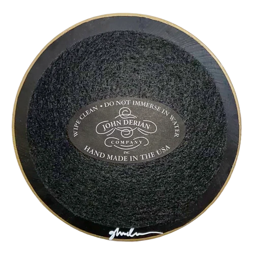 Round black disk with 'John Derian' branding on a white background