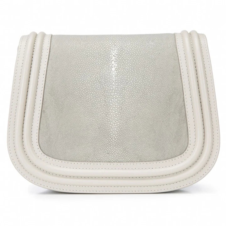 Silver and white leather saddle bag on a white background