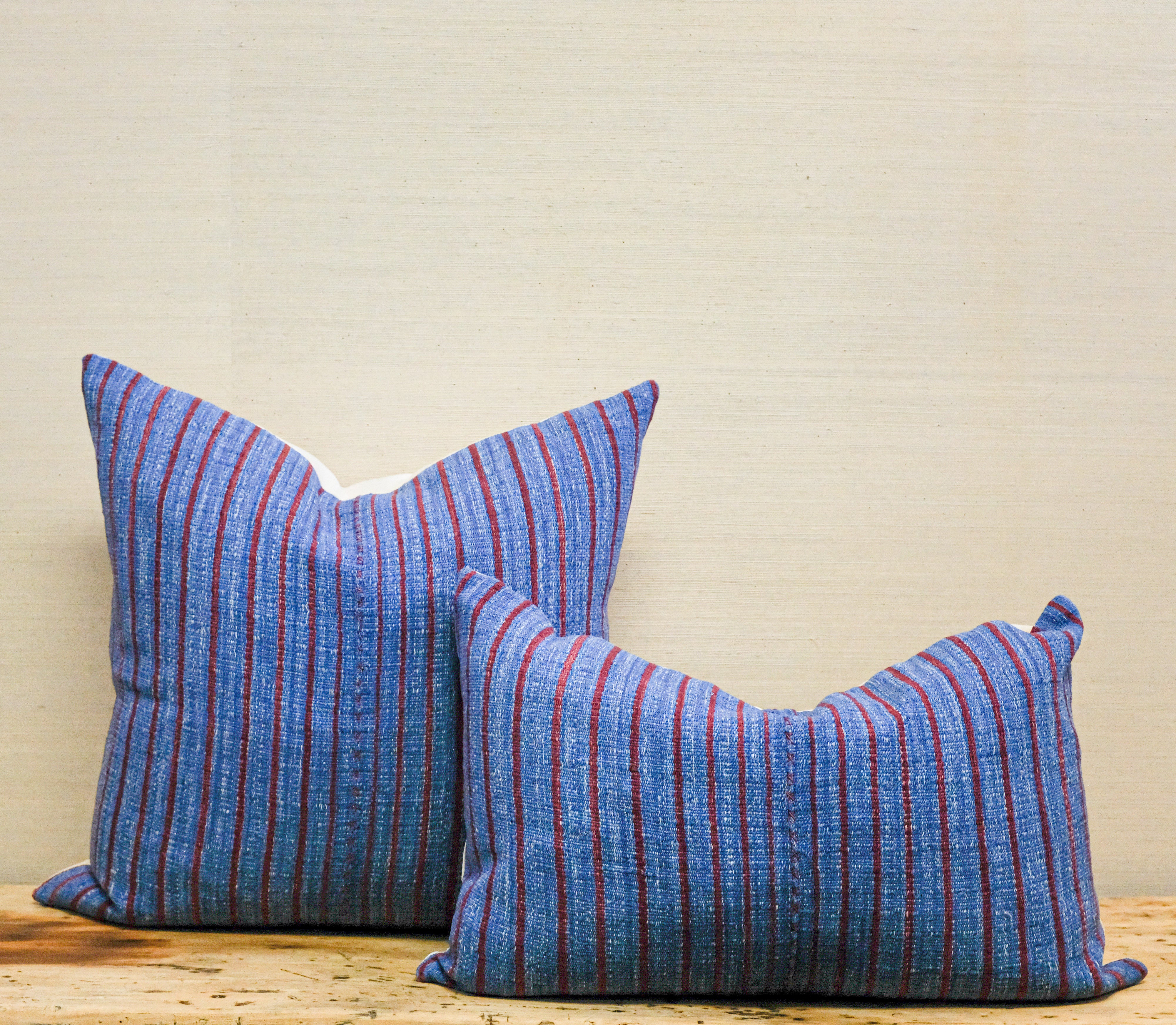 blue and red stripe pillows, one square and one oblong