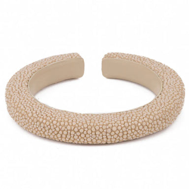 Beige textured bracelet on a white background