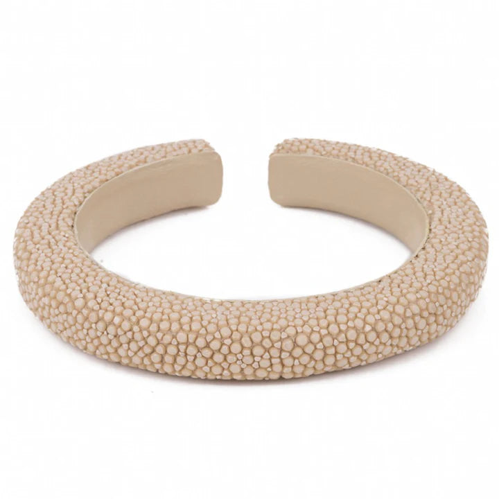 Beige textured bracelet on a white background