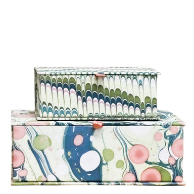 small and large stacked boxes, marbleized paper