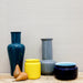 collection of glossy vases in green, yellow, grey and blue