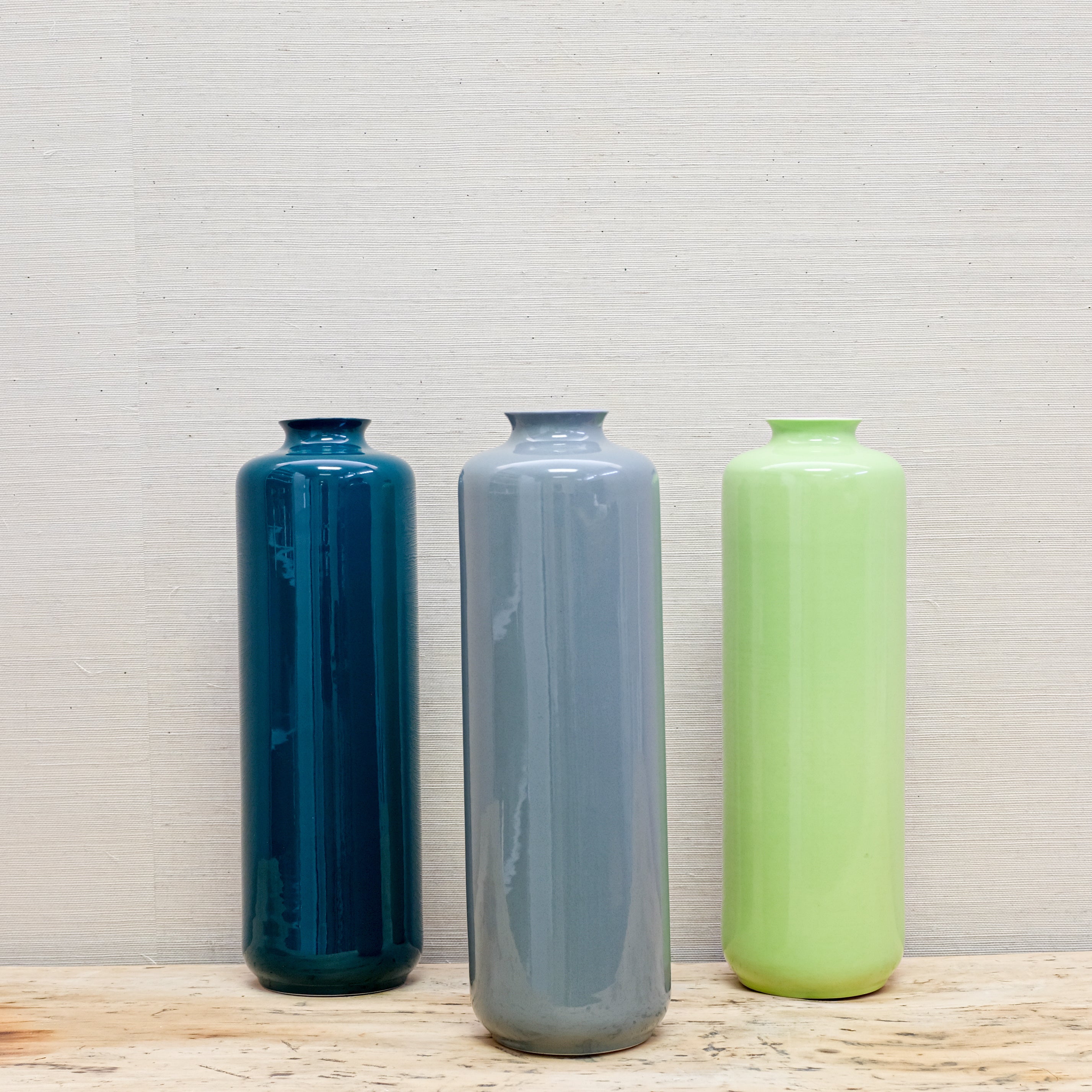 trio of glossy-finish vases