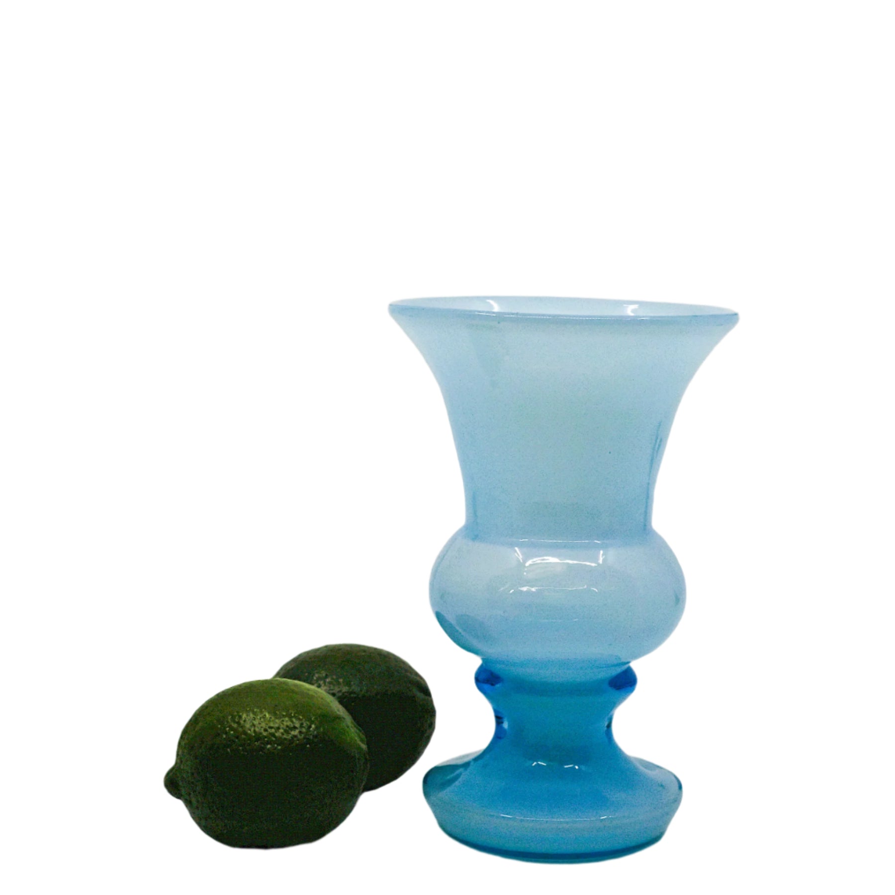 blue vase with two limes for perspective