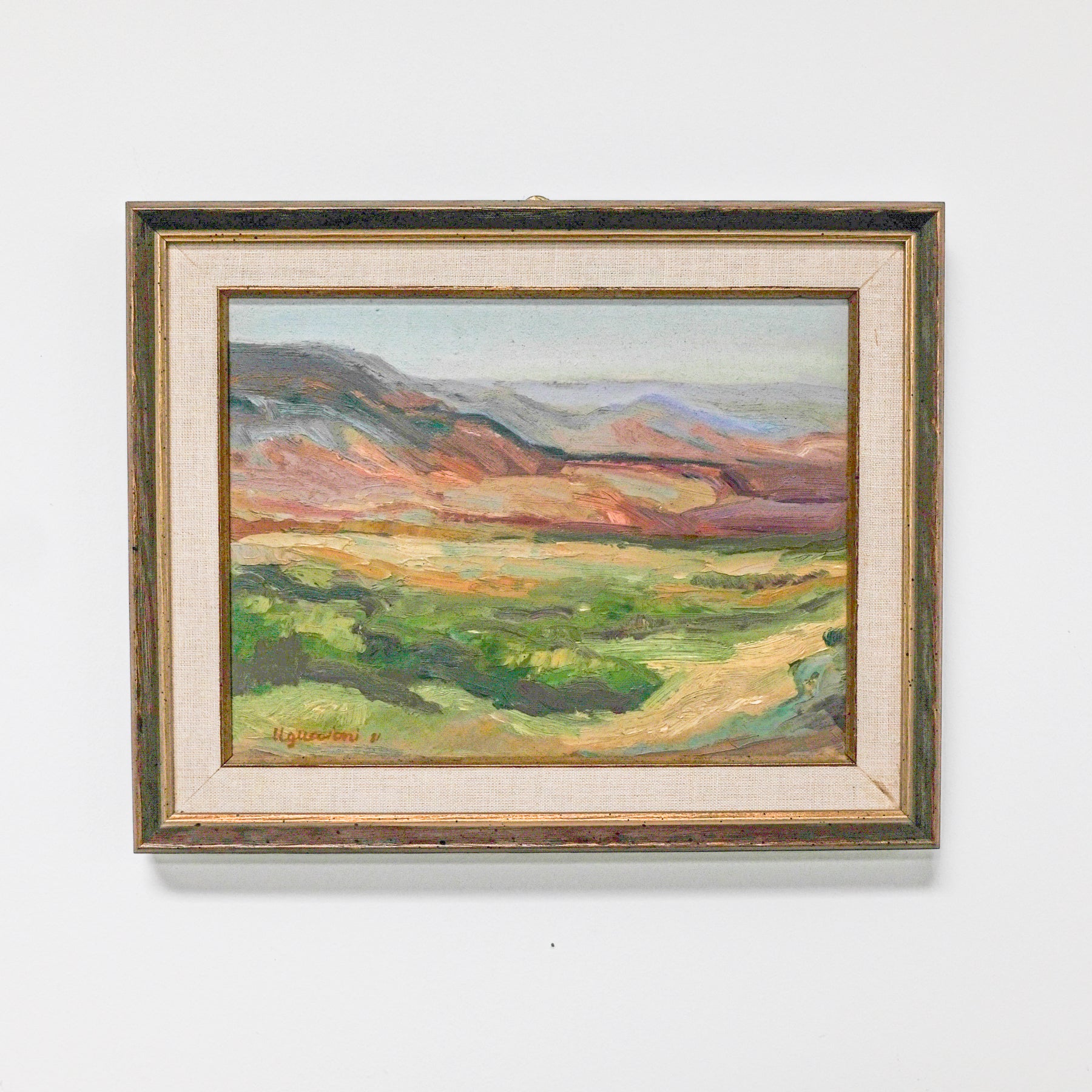landscape painting framed in gold wood and linen inner frame