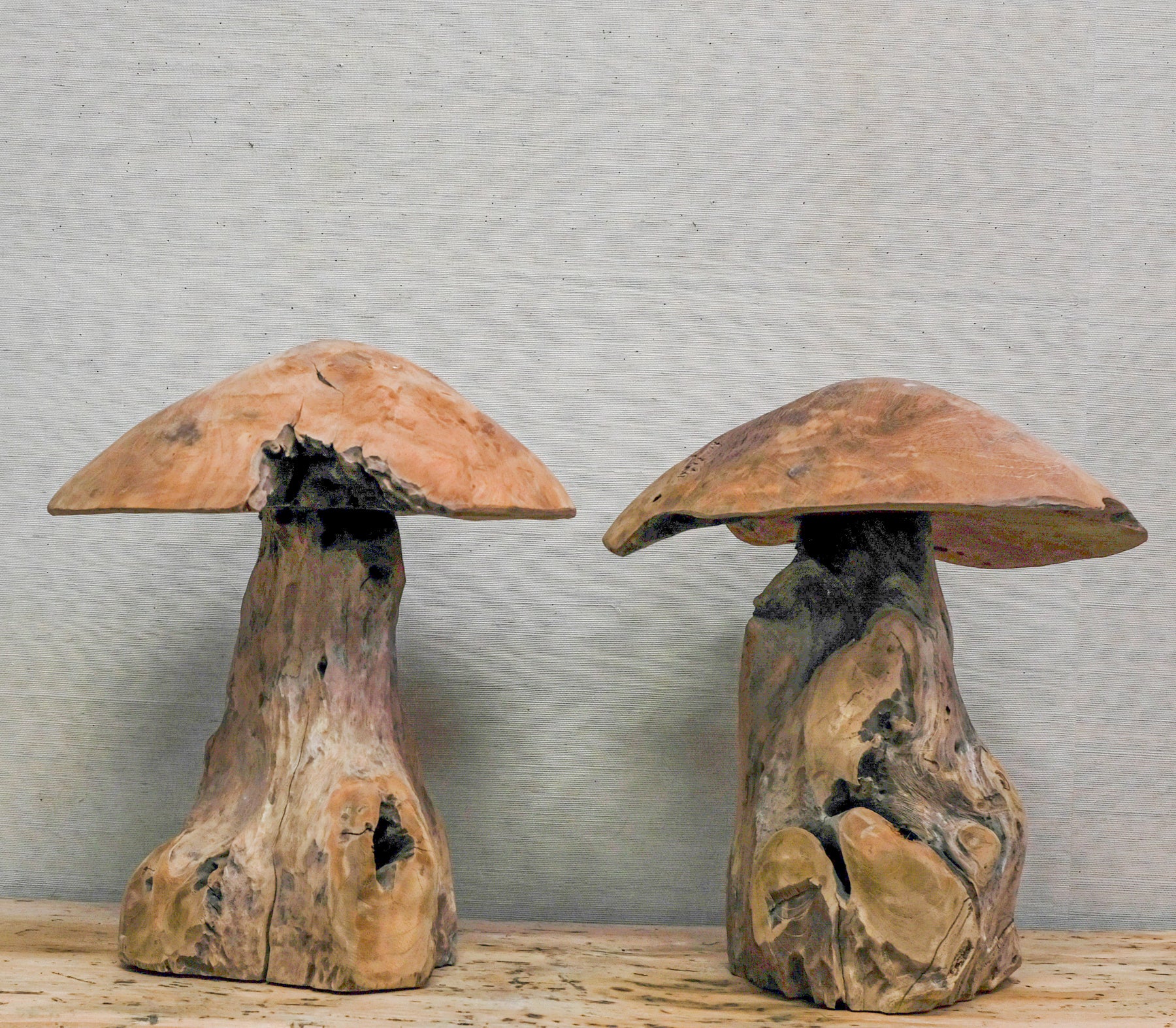 pair of wood mushroom sculpture