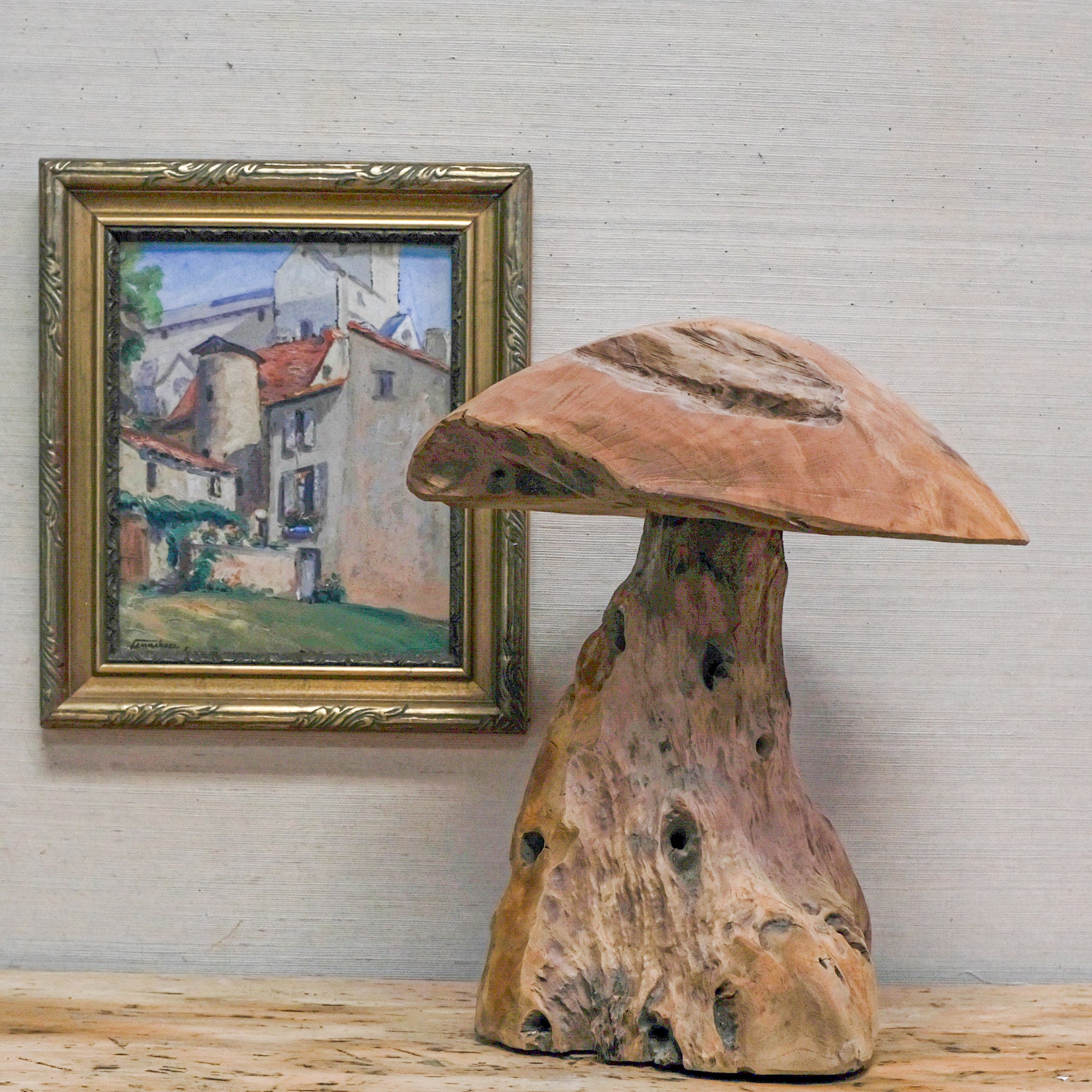 wood mushroom sculpture with framed oil painting
