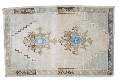 small turkish rug with bright blue center medallions