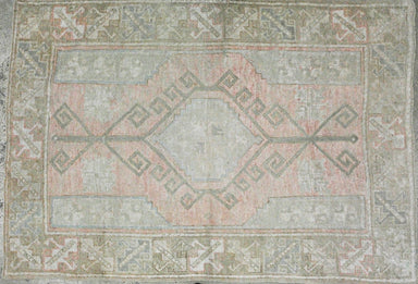 pale pink oushak with pale blue accent line