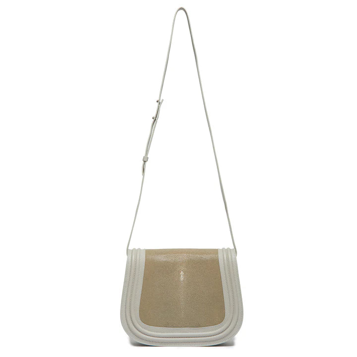 Beige and white crossbody bag on a white background