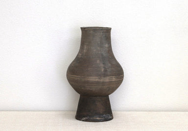 rustic handmade pottery vessel in dark grey