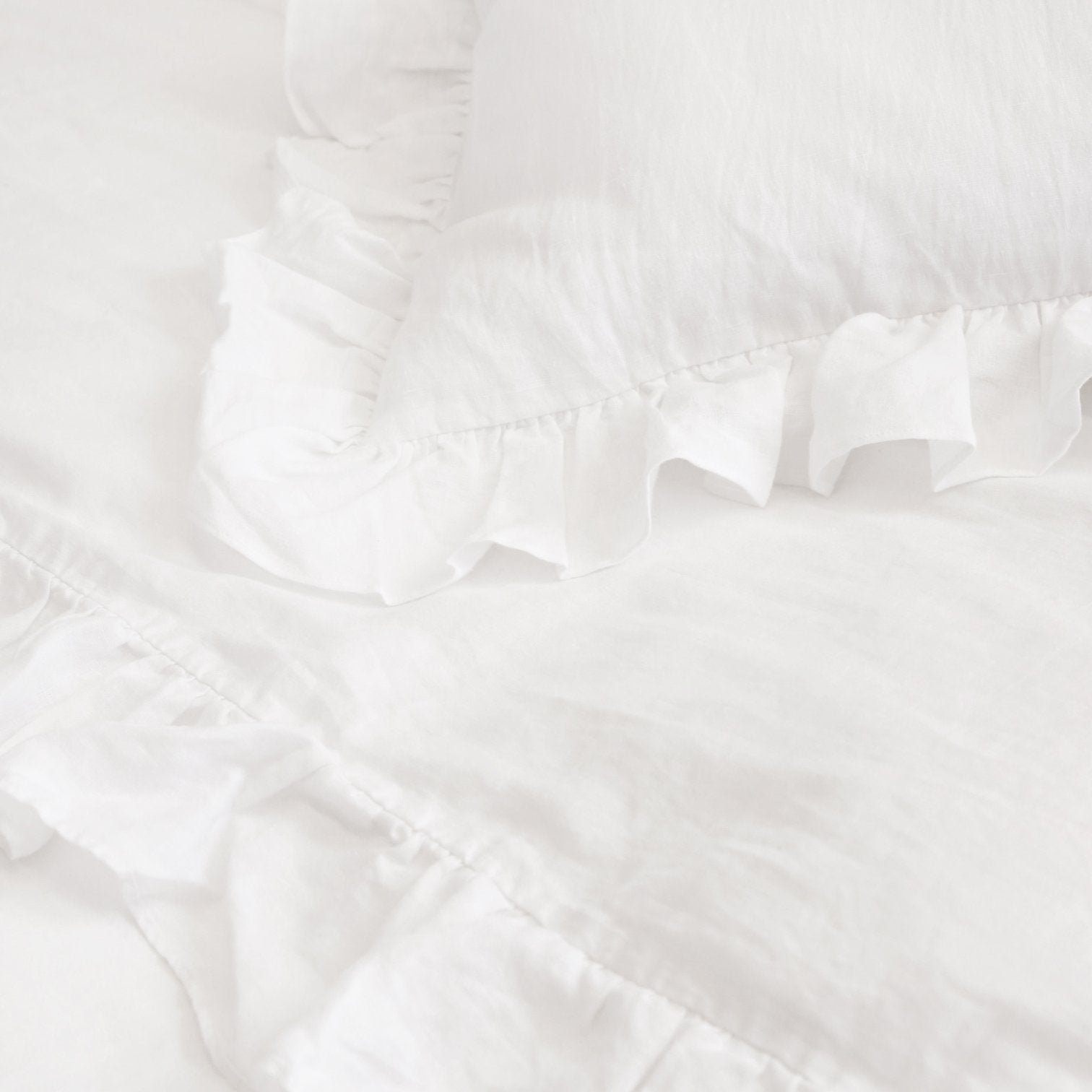 white linen sham with ruffle