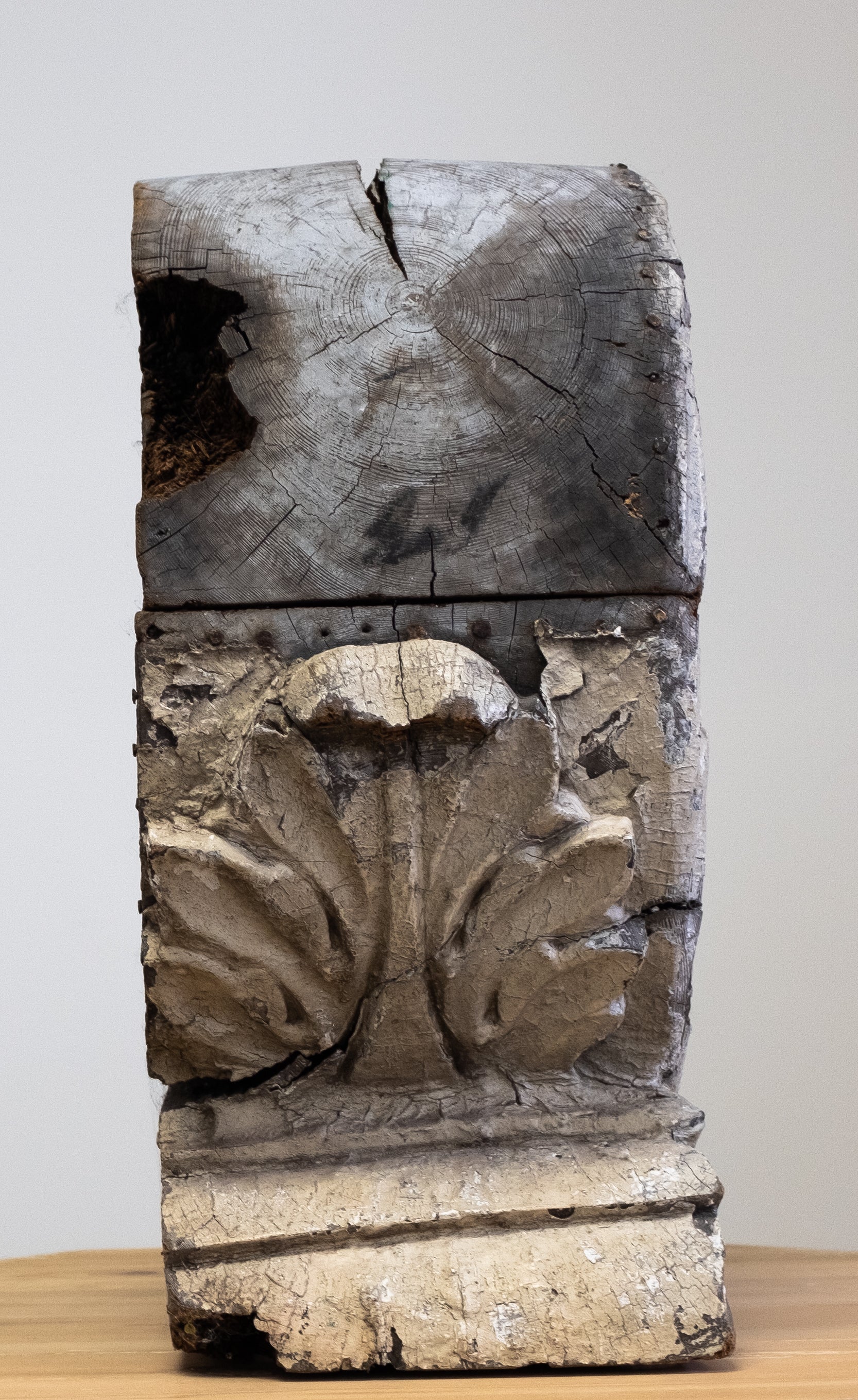 side view of antique wood carved architectural fragment