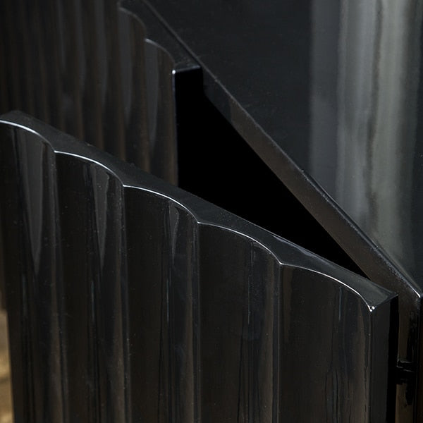 detail of door on scalloped front console cabinet