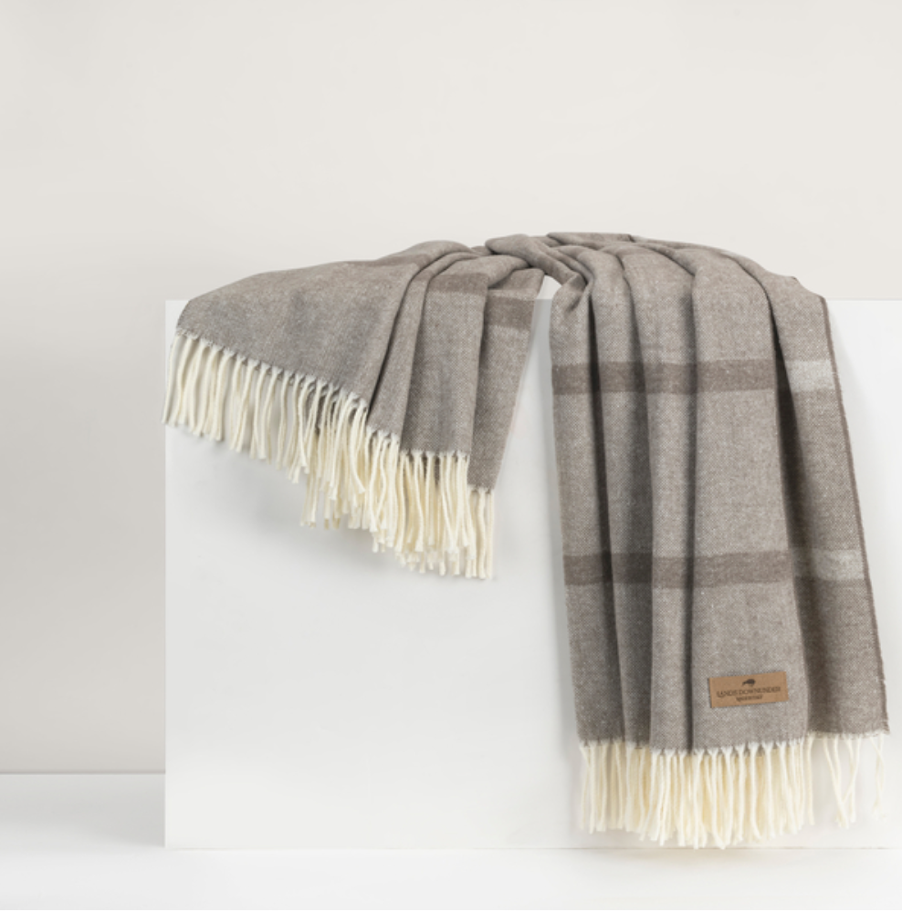 mink-color striped throw with fringe