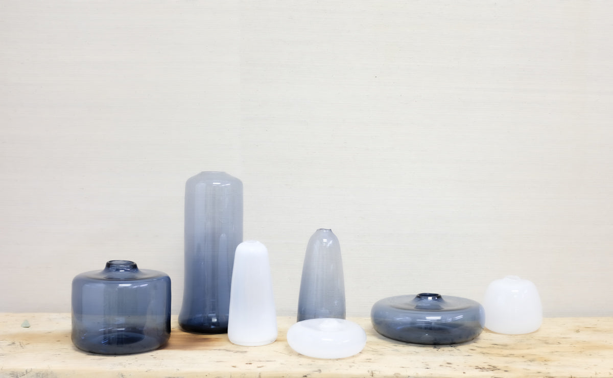 transparent blue and white glass bottles