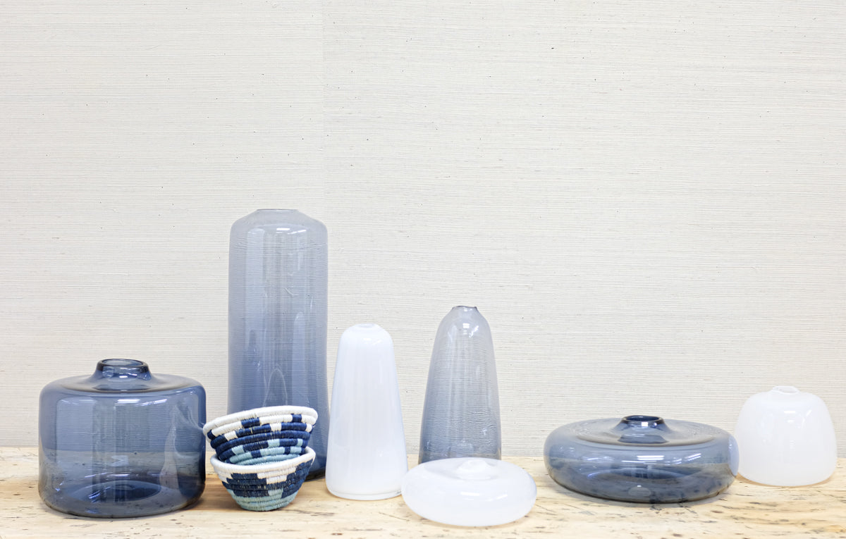 blue transparent glass vases with milky white vases and small baskets