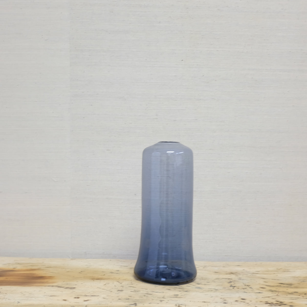 tall blue glass bottle