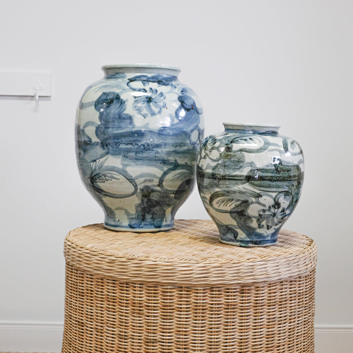 blue and white jars on wicker table
