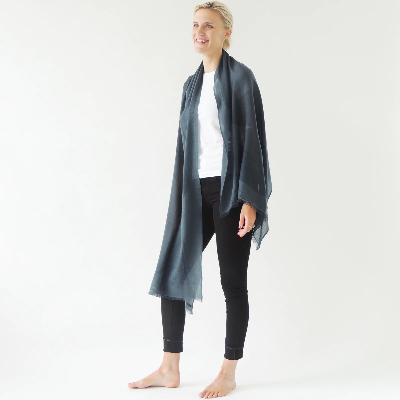 woman modeling slate-blue merino wool scarf