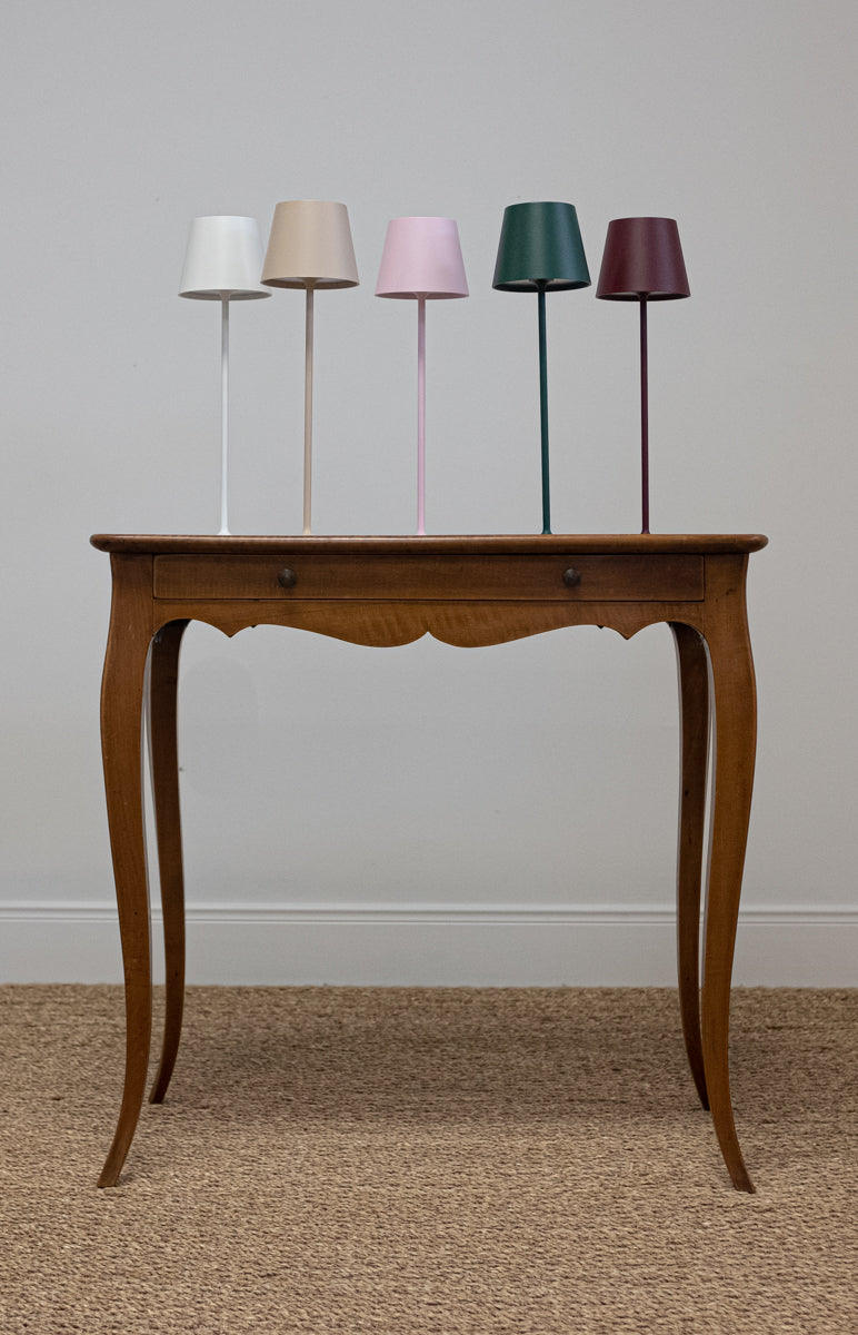 grouping of cordless lamps on antique table