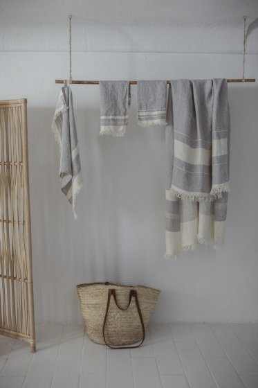 collection of grey and ivory striped linen towels