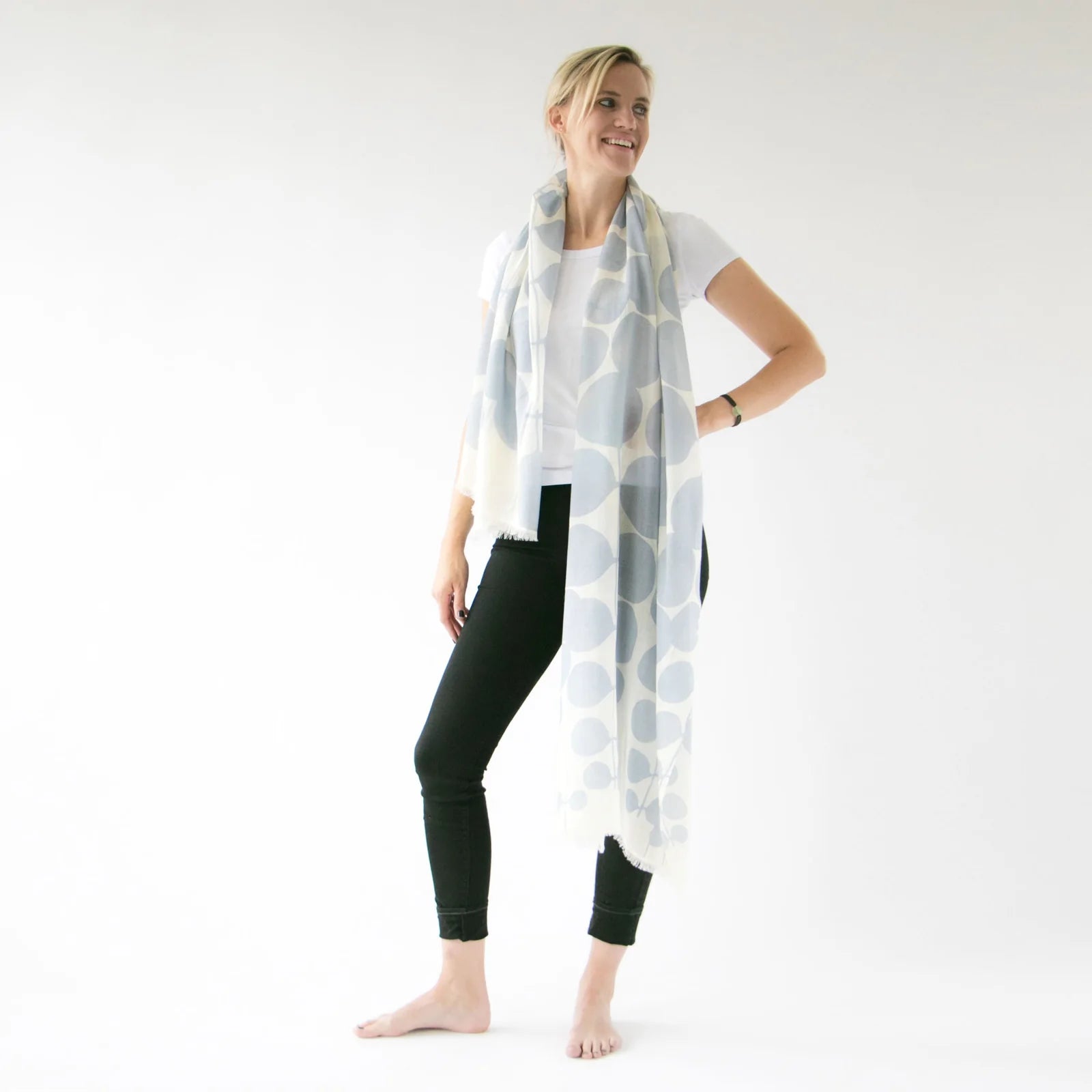 woman modeling pale blue merino wool scarf