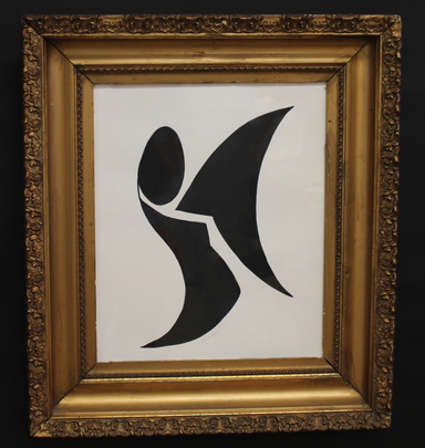Framed artwork with a black abstract design on a white background
