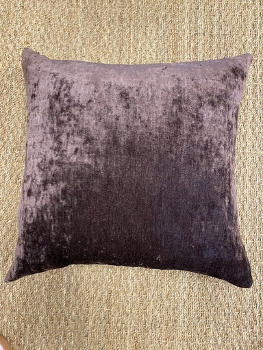 Textured sugar brown pillow on a beige carpet