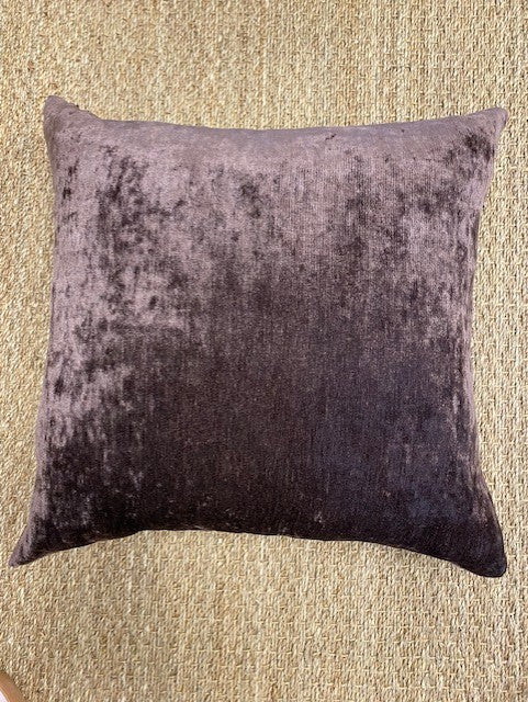 Textured sugar brown pillow on a beige carpet