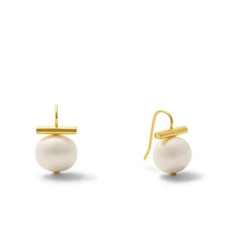 A pair of gold and white pearl earrings on a clean white background. Each earring features a round white pearl suspended below a polished gold bar, with one earring shown from the front and the other from the side to display the hook.