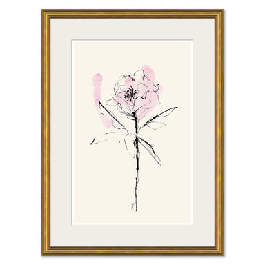 Framed wall art featuring a minimalist black ink sketch of a single flower with soft pink watercolor washes on an off-white background, enclosed in a white mat and a gold frame.