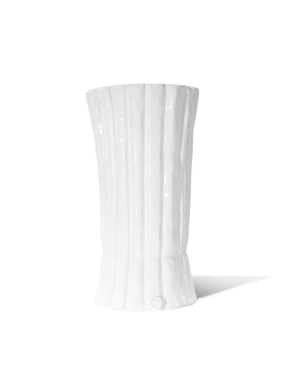 White vase with vertical ribbing on a white background
