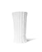 White vase with vertical ribbing on a white background