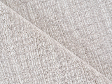 Close-up of textured soft taupe rug