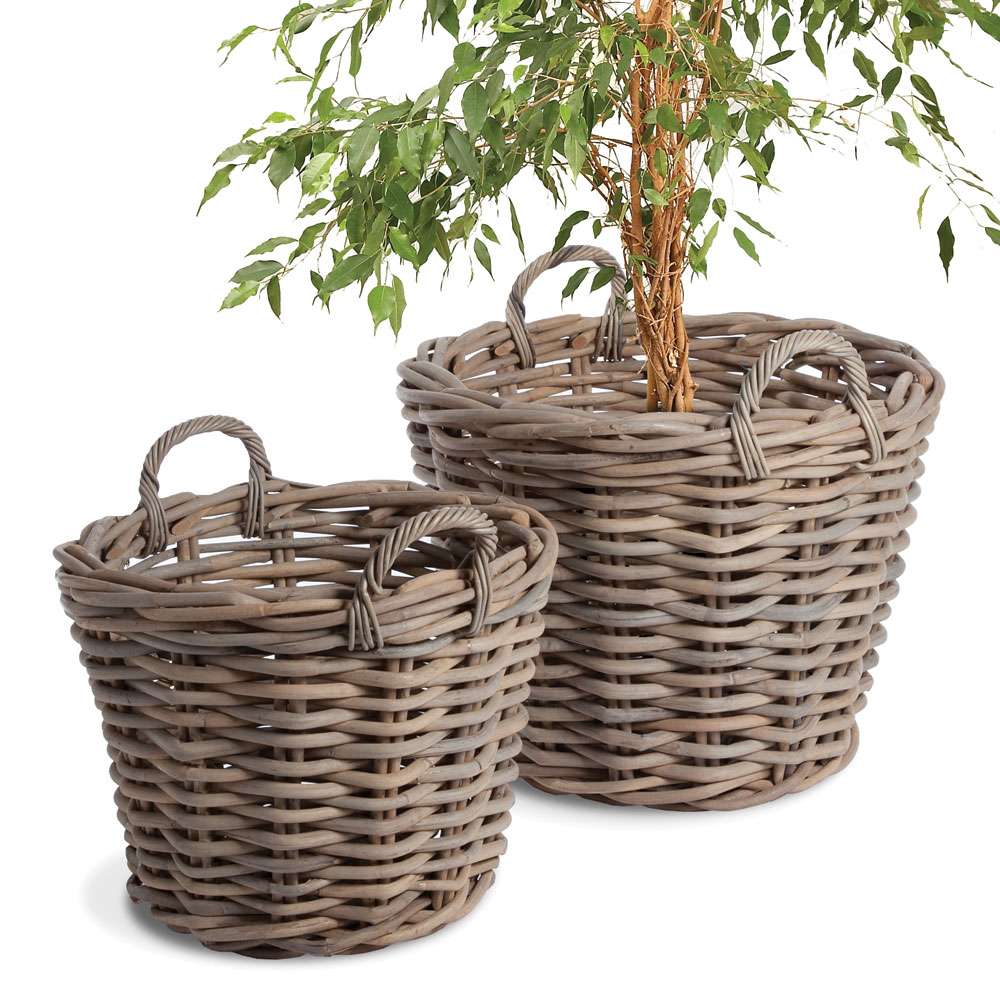 Two wicker planters with handles on a white background