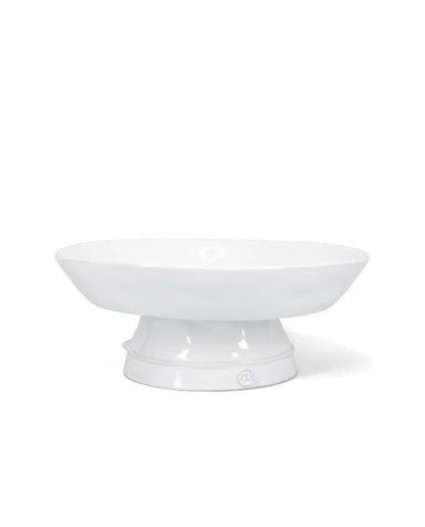 A white ceramic pedestal bowl with a wide, shallow oval bowl and a flared base, shown on a clean white background.