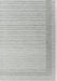Textured rug with a striped pattern on a plain background