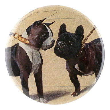 Round button with two dogs on a beige background