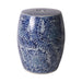 Blue and white floral patterned ceramic stool on a white background
