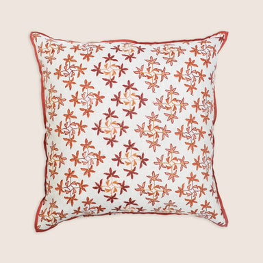 Decorative pillow with floral pattern on a beige background